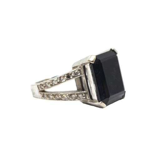 169 - BritishContemporaryAn 18 carat white gold, diamond and black gemstone dress ringWeight: Approx. 9.62... 