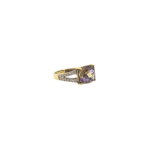 170 - EuropeanContemporaryAn ametrine and diamond dress ringThe ovoid shaped mixed-cut ametrine with bifur... 