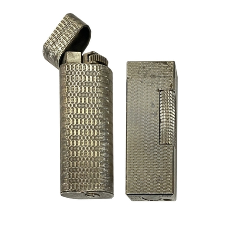 212 - Dunhill and CartierVintageTwo lighters in silverProperty of a noblemanDimensions:(Dunhill) 2.5 in. (... 