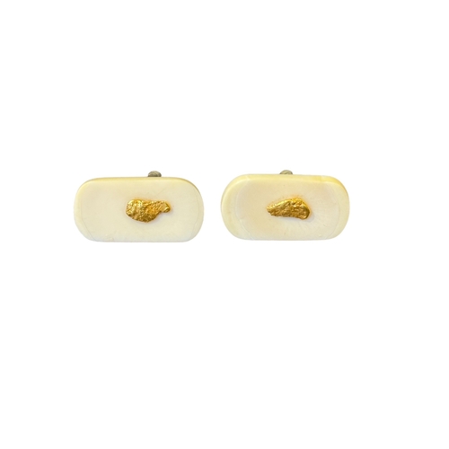 213 - ContinentalCirca 1970Two pairs of cufflinks[a] A pair of petrified wood and yellow metal cufflinks[b... 