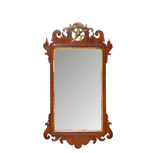 337 - 18th centuryA pier mirror with phoenix design at the topProvenance: The Sloane ClubDimensions:37 in.... 