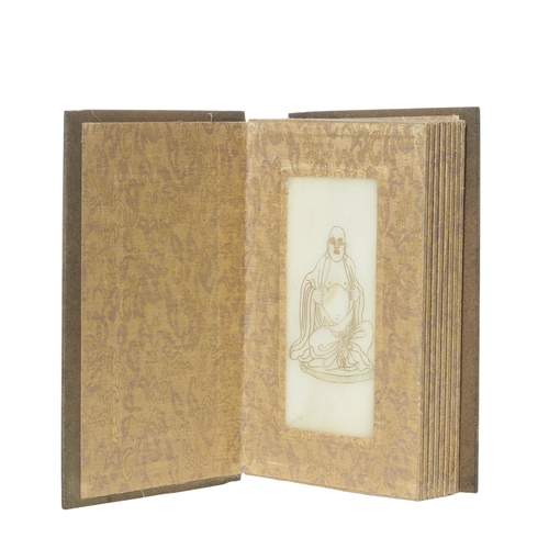 352 - Early 20th CenturyChineseA white jade bookComprising panels inscribed with calligraphy, bound with w... 