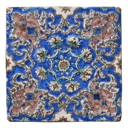 353 - 19th CenturyQajarA decorative moulded tileWith mixed foliate motifs, the background white with folia... 