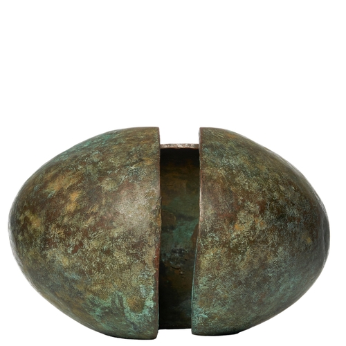 359 - West AfricanA large copper currency pieceThe hollowed rounded metal with a deep patinaDimensions:6.2... 