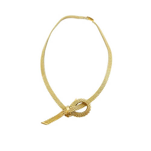 176 - British1972A 9 carat gold flexible brick link necklaceWith tied bow centreWeight: Approx. 41.52 gram... 