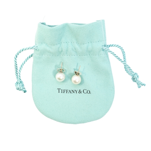 187 - Tiffany and Co.ContemporaryA pair of single stone cultured pearl ear studsWith the original Tiffany ... 