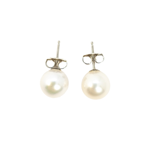 187 - Tiffany and Co.ContemporaryA pair of single stone cultured pearl ear studsWith the original Tiffany ... 