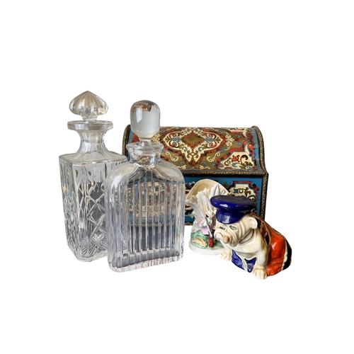 659 - 20th CenturyAn eclectic selection of objets[a] Two cut glass decanters[b] Five tobacco pipes, with a... 