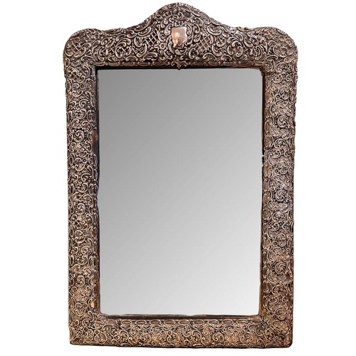 335A - BritishEdwardianA repoussé silver-clad dressing table mirrorDimensions:20.25 in. (H) x 13.5 in. (W) ... 