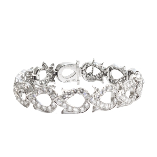 143 - Cartier, ParisCirca 1990A fine diamond and 18 carat white gold 'fuchsia' braceletThe bracelet compos... 