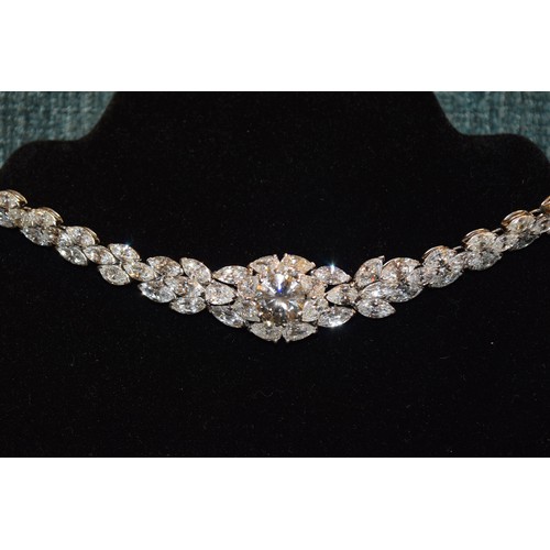 123 - Circa 1990A fine and impressive diamond and platinum necklaceThe central brilliant cut diamond weigh... 