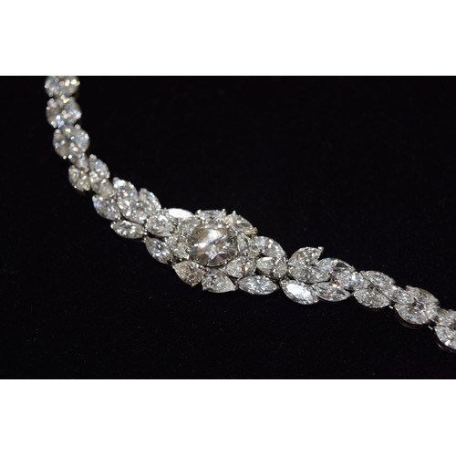 123 - Circa 1990A fine and impressive diamond and platinum necklaceThe central brilliant cut diamond weigh... 