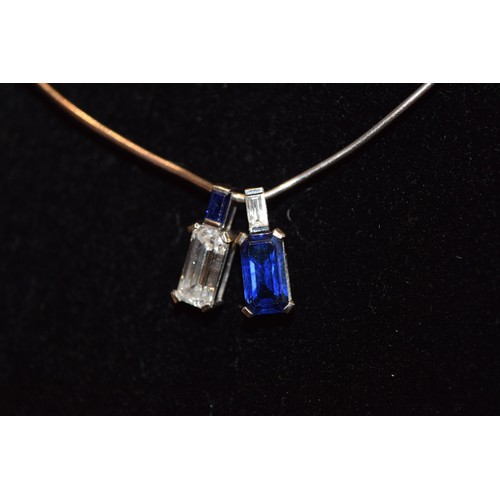 130 - ContinentalCirca 1970A fine emerald-cut diamond and sapphire pendant necklaceThe emerald-cut diamond... 