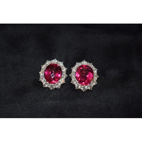 140 - BritishCirca 1990An impressive pair of pink tourmaline and brilliant cut diamond cluster earringsThe... 