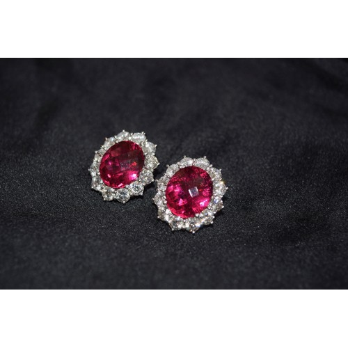 140 - BritishCirca 1990An impressive pair of pink tourmaline and brilliant cut diamond cluster earringsThe... 