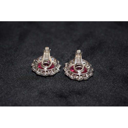 140 - BritishCirca 1990An impressive pair of pink tourmaline and brilliant cut diamond cluster earringsThe... 