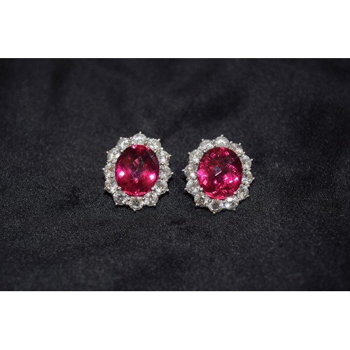 140 - BritishCirca 1990An impressive pair of pink tourmaline and brilliant cut diamond cluster earringsThe... 