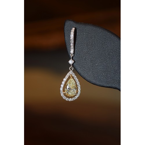 141 - BritishContemporaryA fine pair of yellow diamond and diamond drop earringsThe main pear-shaped diamo... 