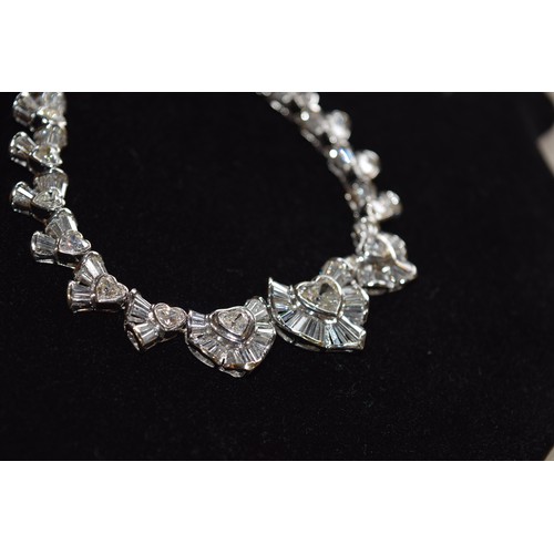 142 - BritishCirca 2000An attractive diamond necklaceComposed of heart-shaped diamond and calibré baguette... 