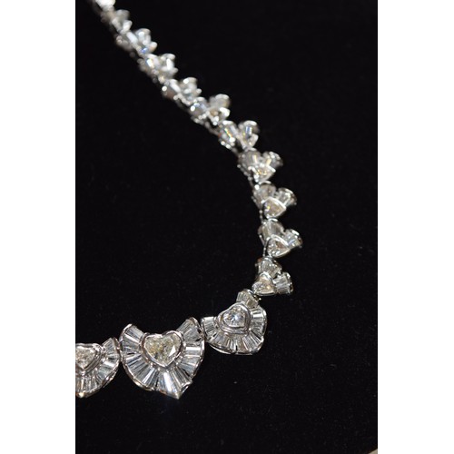 142 - BritishCirca 2000An attractive diamond necklaceComposed of heart-shaped diamond and calibré baguette... 