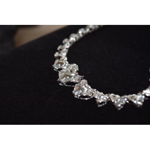 142 - BritishCirca 2000An attractive diamond necklaceComposed of heart-shaped diamond and calibré baguette... 