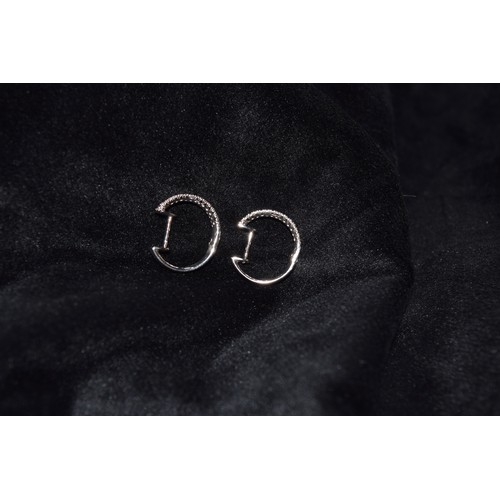 167 - BritishContemporaryA pair of pavé set diamond and 18 carat white gold hoop earringsWeight: Ap... 