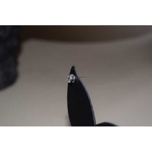 191 - BritishCirca 1960A pair of diamond and platinum ear studsThe brilliant cut diamonds weighing approxi... 