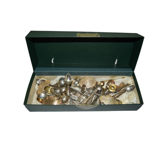 124 - A box of silver itemsTo include: [a] Twelve silver spoons (tea & mustard)[b] Five bottle la... 