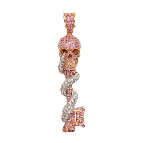 13 - Theo FennellBritishCirca 2010An usual pink gold, diamond and pink sapphire skull and key pendantWeig... 