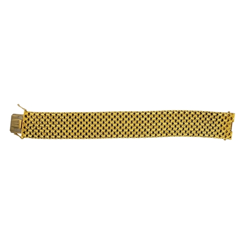 25 - BritishCirca 1970A heavy 18 carat yellow gold textured mesh link braceletWeight: Approx. 94.38 grams... 