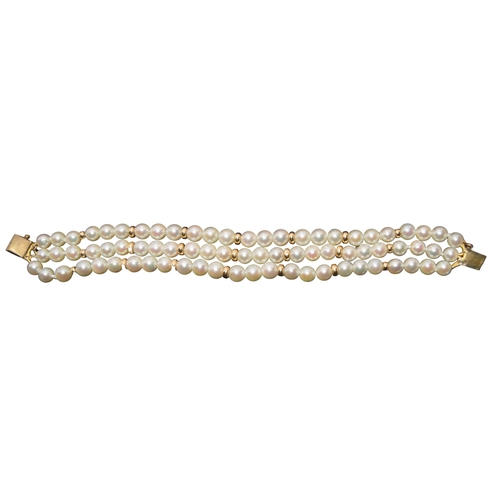 34 - ContinentalCirca 1960A three row culture pearl and yellow metal braceletWeight: Approx. 19.22 gramsD... 