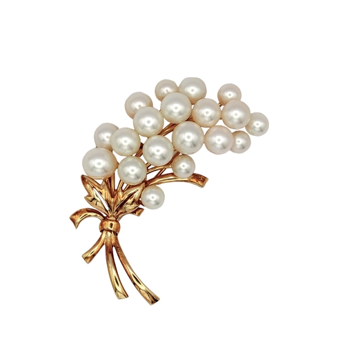 45 - MikimotoJapaneseCirca 1960A yellow gold and cultured pearl spray broochWeight: Approx. 15.03 gramsDi... 