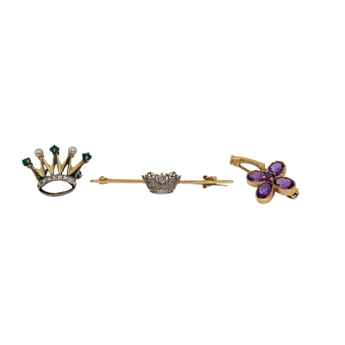 68 - BritishEdwardianA group of three brooches[a] A diamond and gold coronet brooch[b] An amethyst and ni... 