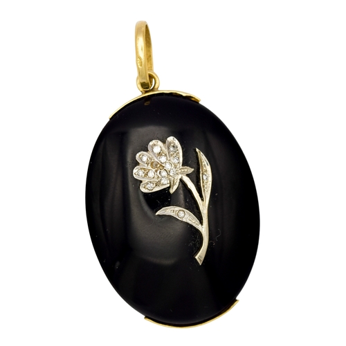 87 - EuropeanCirca 1970[a] A black onyx, gold and diamond pendant, the oval onyx applied with a diamond s... 