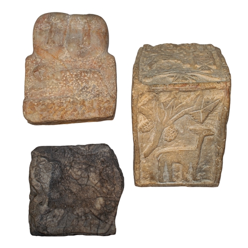 306 - South ArabianA group of three relief fragments[a] A stone relief of a lion, serpent and hound[b] A t... 