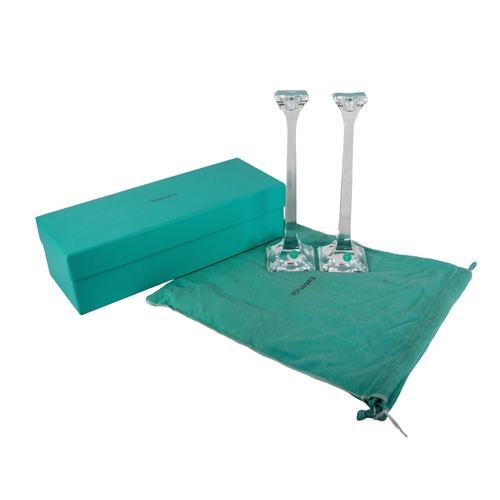 659 - TiffanyContemporaryA pair of glass candlesticksWith the original Tiffany blue pochette and boxTo be ... 