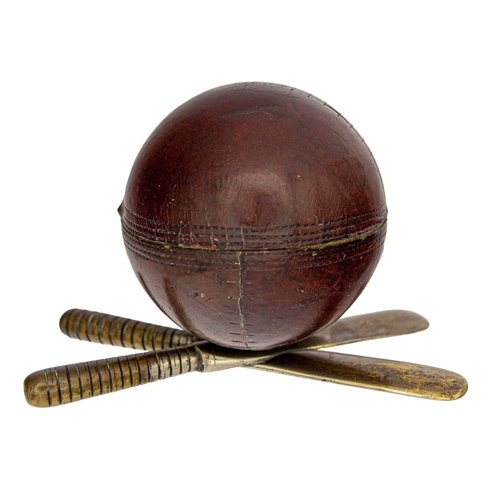 664 - EdwardianA cricket ball on two bats, comprising an inkwell insideDimensions:3.25 in. (H) x 4.5 in. (... 