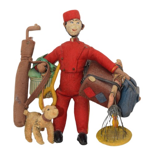 662 - SteiffCirca 1910A bellboy figurineWith luggage and a dogDimensions:9.25 in. (H)... 