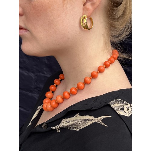 48 - ItalianCirca 1870A large graduated coral bead necklace, comprising 28 larger graduated coral beads, ... 