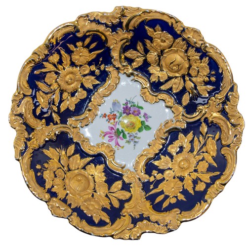 676A - 20th century, MeissenA bowl with cobalt blue ground and gilt relief floral and foliate decoration, w... 