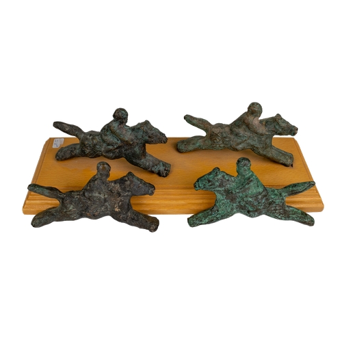 93 - Middle EasternA group of four bronze horses and ridersFrom the Dr Mohammed S Farsi CollectionDimensi... 