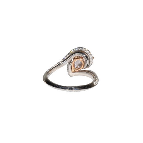 12 - EuropeanContemporaryA pretty, treated fancy intense orange pink diamond ringThe pear shaped modified... 