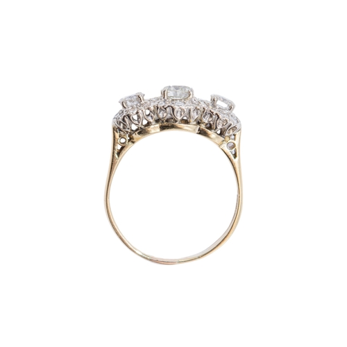 14 - EuropeanContemporaryA triple diamond cluster ring, mounted in 18k white and yellow goldWeight: Appro... 