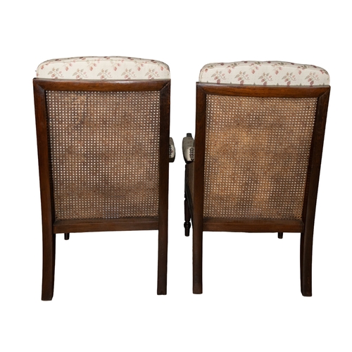 140 - Late 19th centuryA pair of Gainsborough armchairsMahogany, with fluted legs and caned seat Dime... 