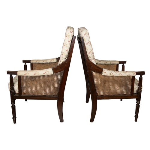 140 - Late 19th centuryA pair of Gainsborough armchairsMahogany, with fluted legs and caned seat Dime... 