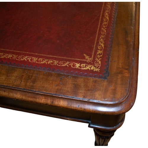 142 - EnglishRegency a table deskOak, with red leather gilt stamped top and fluted column legsProperty of ... 