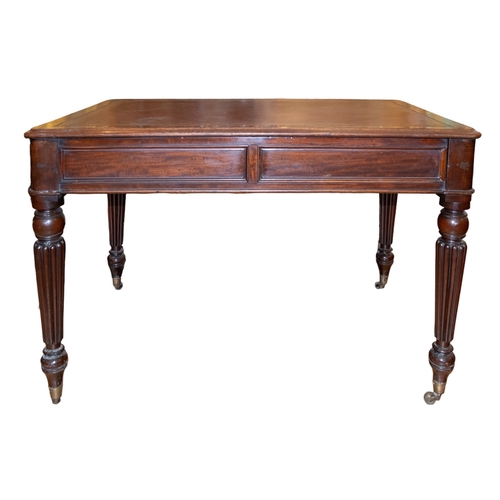 142 - EnglishRegency a table deskOak, with red leather gilt stamped top and fluted column legsProperty of ... 