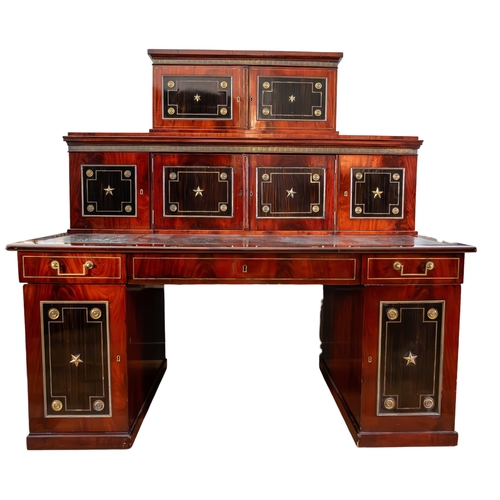 146 - Russianc.1820-40A brass mounted mahogany and ebony desk, with decorative inlaid wood panels with gil... 