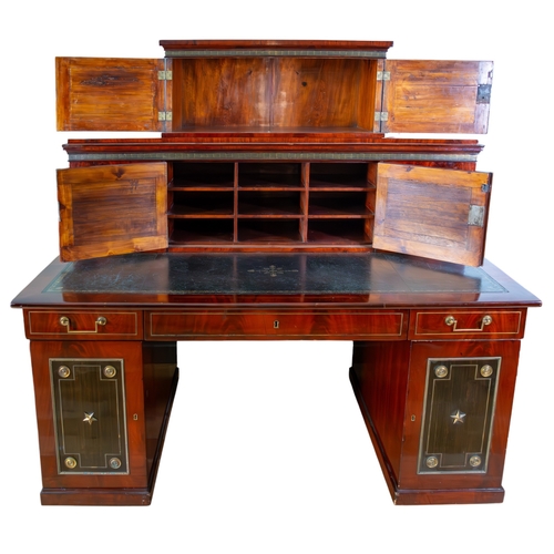 146 - Russianc.1820-40A brass mounted mahogany and ebony desk, with decorative inlaid wood panels with gil... 