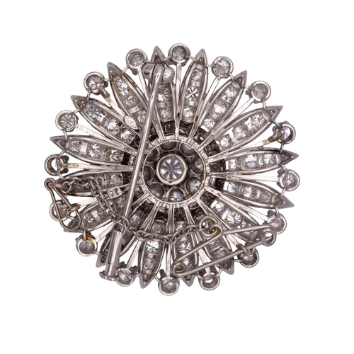 2 - BritishCirca 1960A fine diamond flower head brooch/pendantThe multi-petalled flower set to the centr... 